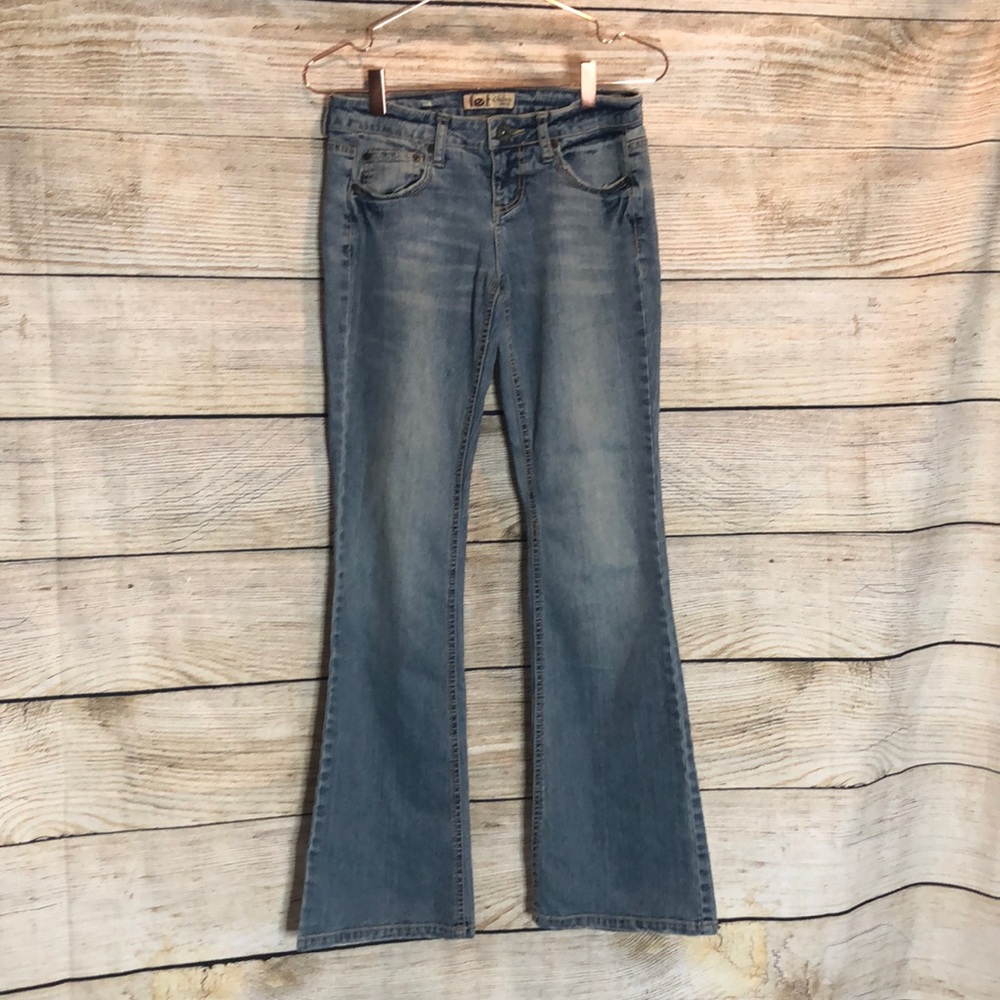 Blue jeans with embellishment on back pockets